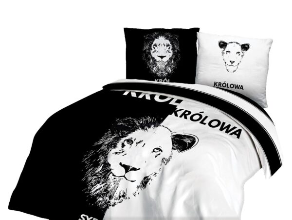 Lamp on wooden table next to a blue and white bed in bedroom int Lamp on wooden table next to a blue and white bed in bedroom int