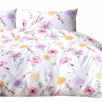 front view of a mockup white bed with a white blanket in a luxur